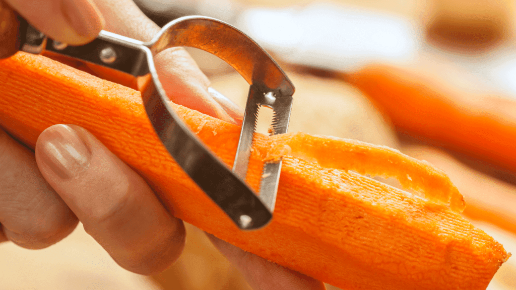 Peel carrots using a peeler
