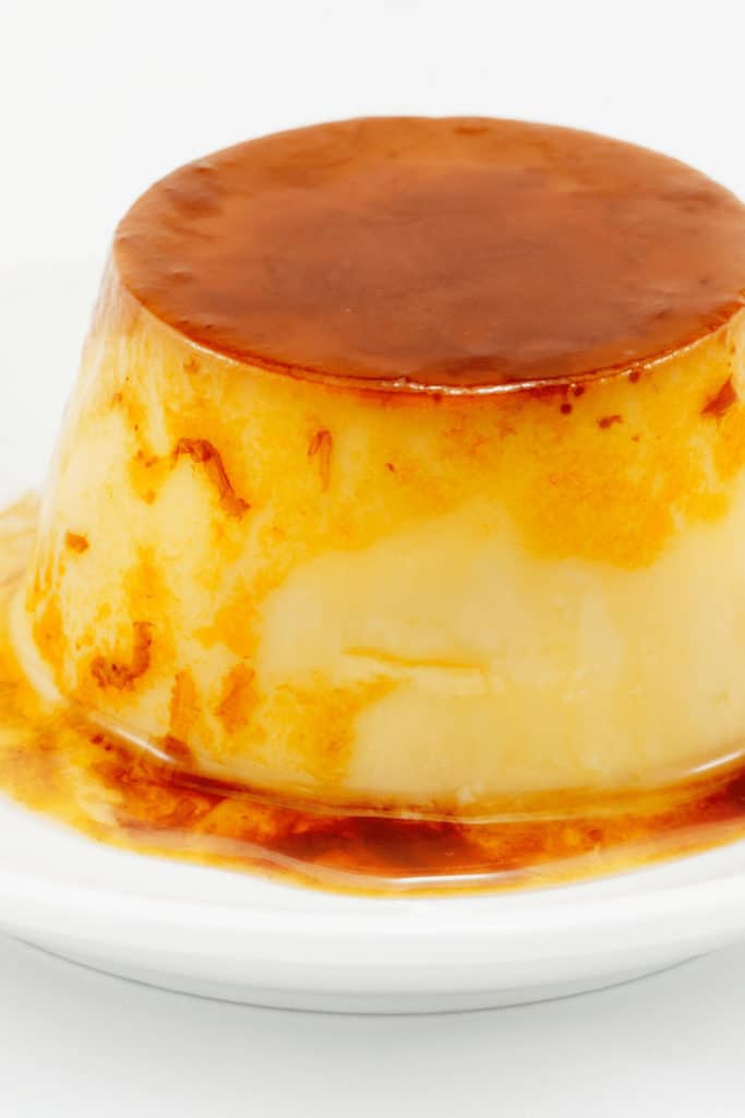 If flan is undercooked cook it for another 10-15min and increase the temperature by 50°F