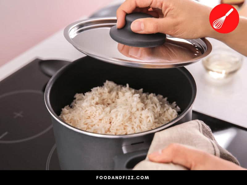 Whether you are using the absorption method or the boiling method, rice needs to be cooked with a tight-fitting lid on top to properly cook. For the boiling method, drain excess water once rice is cooked.