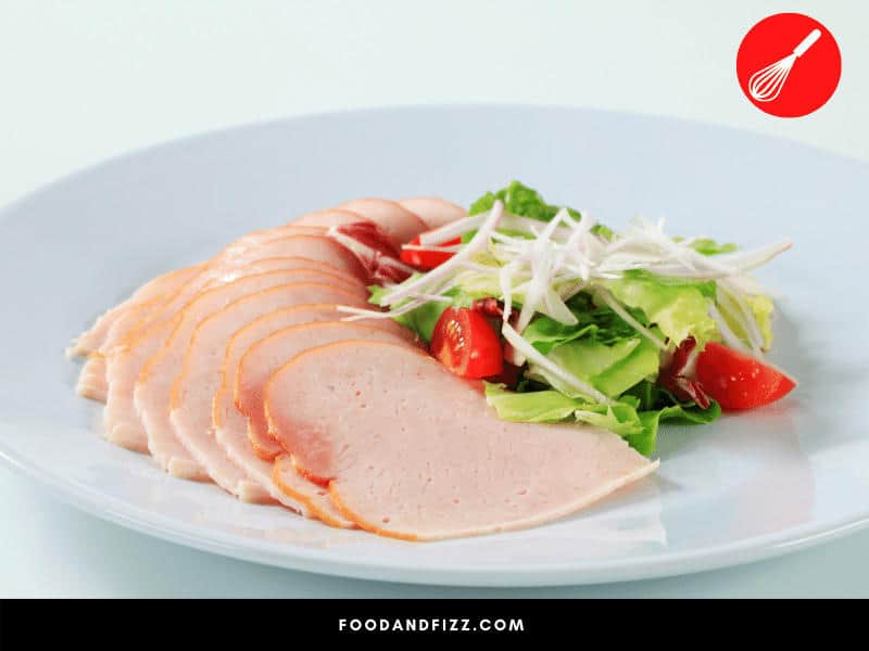 Pink deli turkey is okay to eat, and in moderation, can be part of a healthy diet.