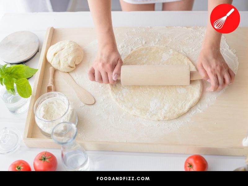 Semolina may be used in place of cornmeal for sprinkling on surfaces to prevent sticking, like when rolling pizza dough.