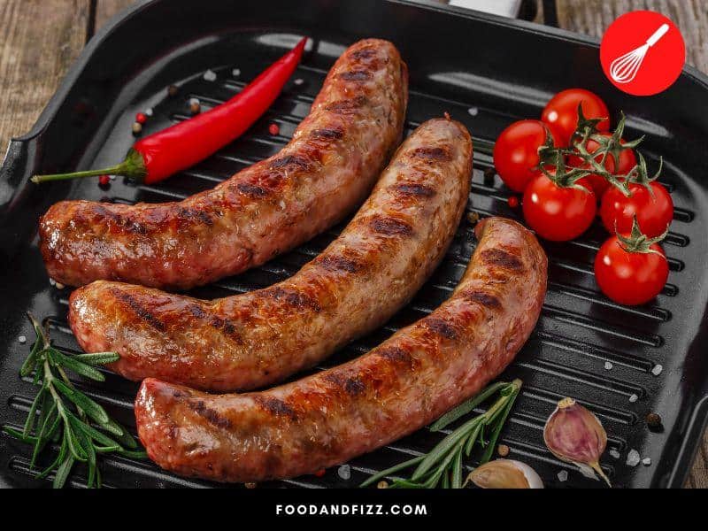 As long as the sausage is properly cooked to at least 160 °F, pink Italian sausage is safe to eat.