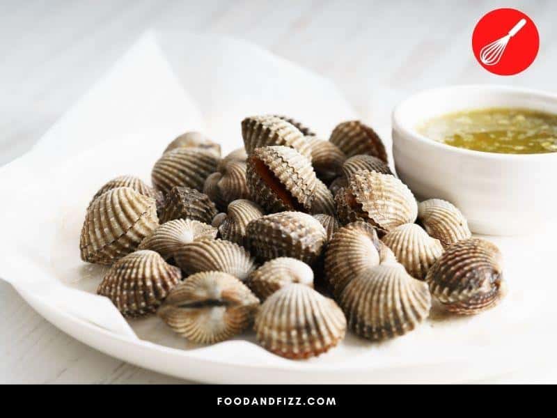 Cockles are rounder and smaller than clams and have an embossed, ribbed texture.