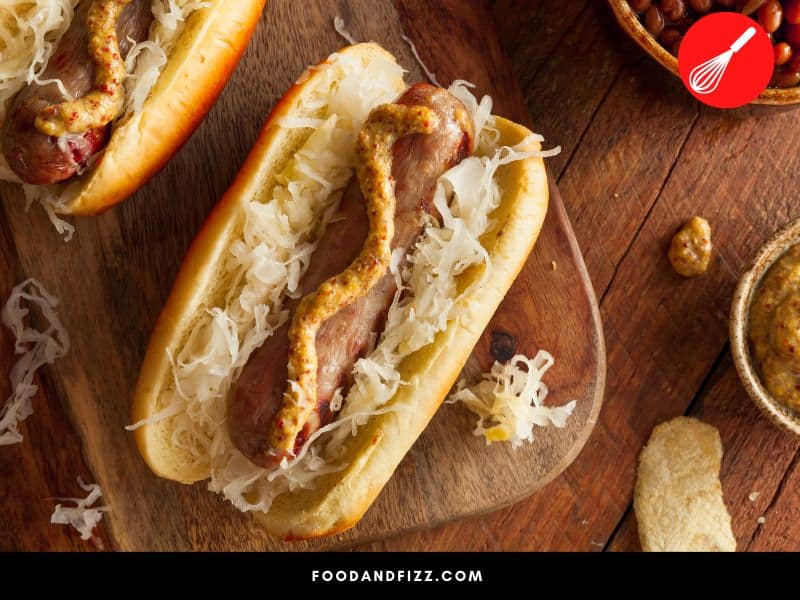 Bratwurst is commonly served in bread rolls, with sauerkraut or condiments like mustard and horseradish.